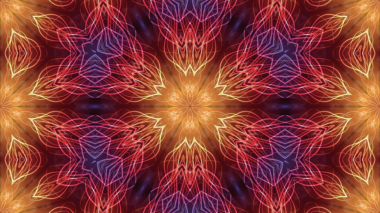 An abstract fractal pattern with intertwining red, orange, and purple lines forming symmetrical shapes against a dark background.