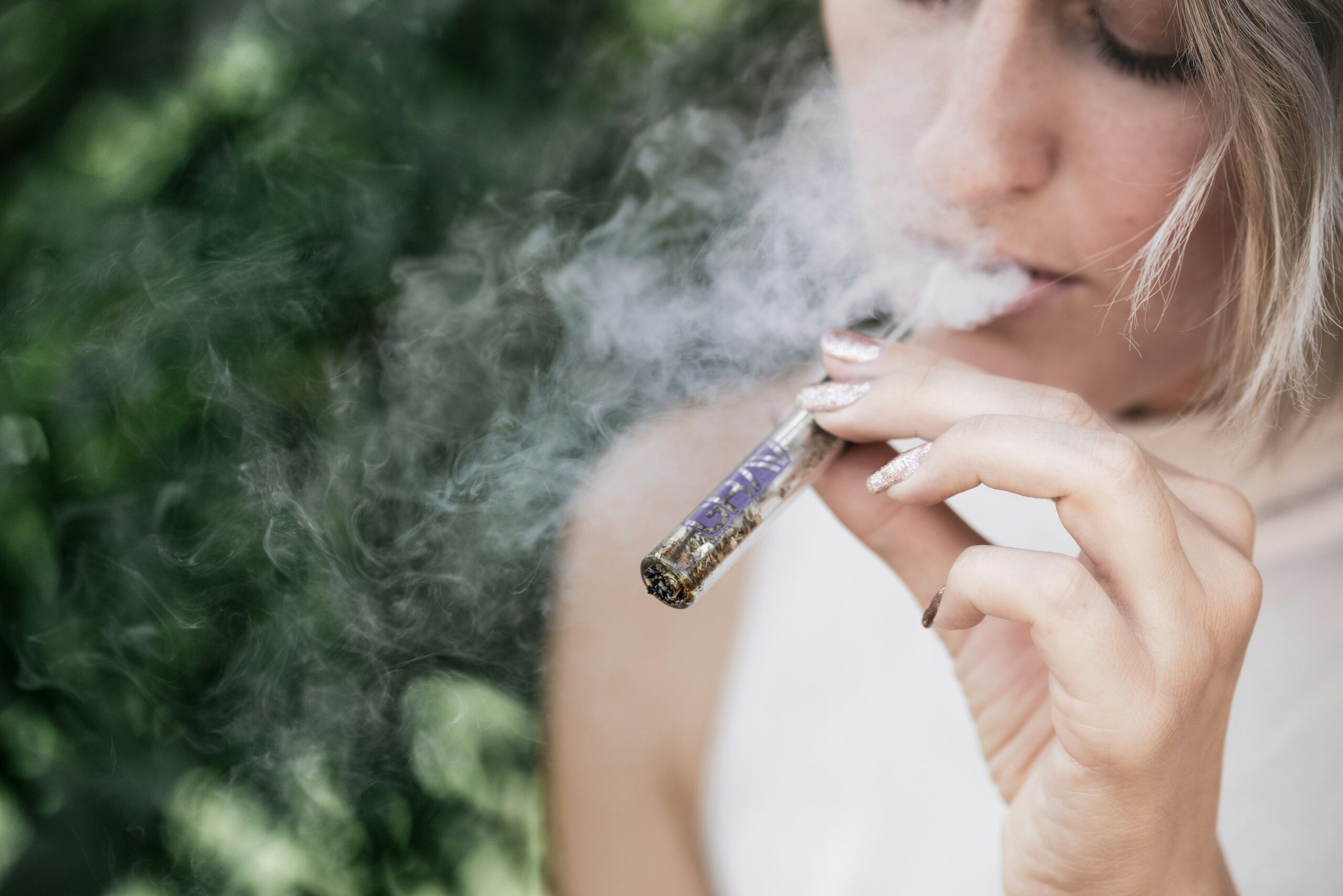 Woman enjoying a THC Cartridge from A1 Terps, your trusted source for weed delivery in Vancouver.