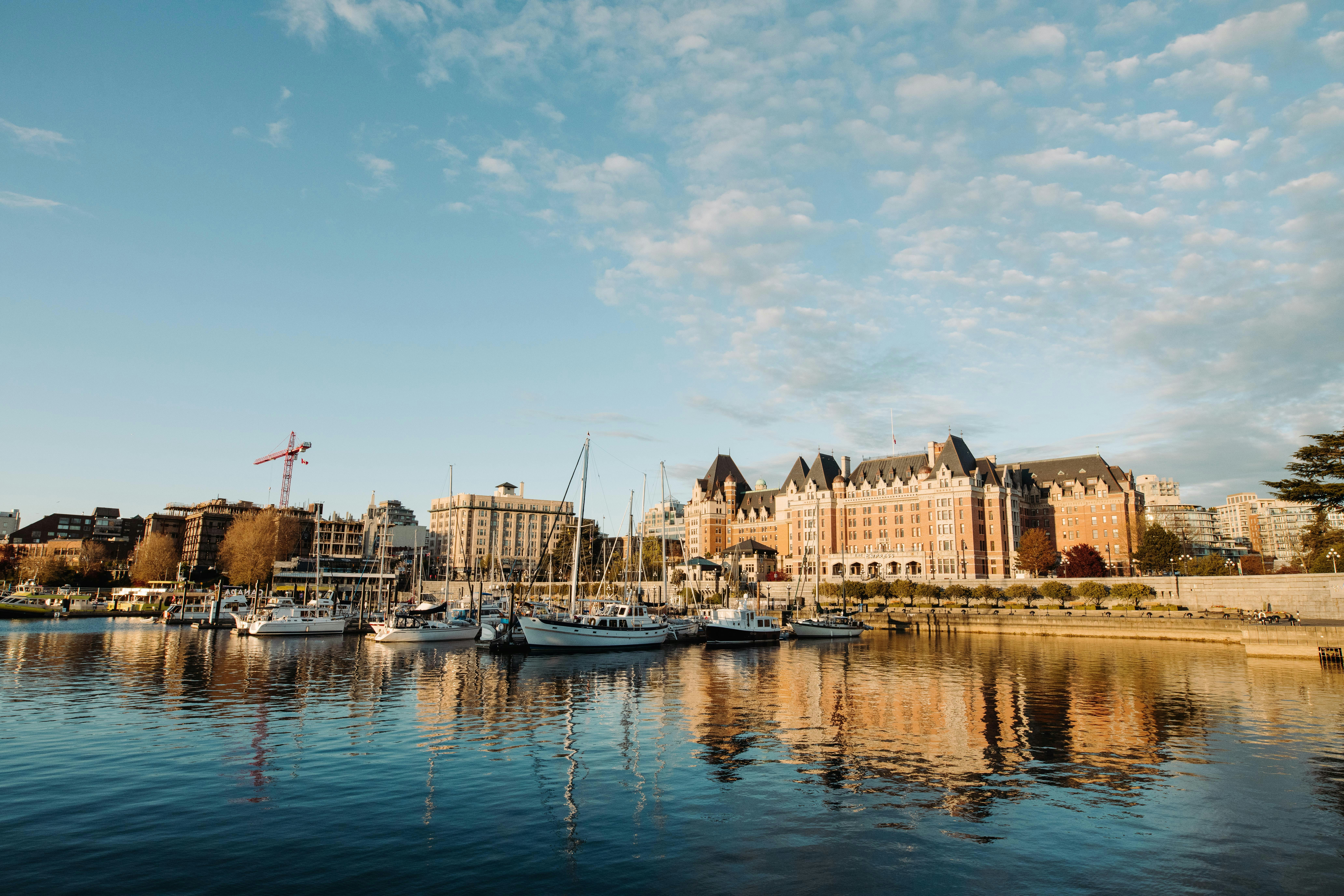 Victoria waterfront with boats and historic buildings representing weed delivery Victoria
