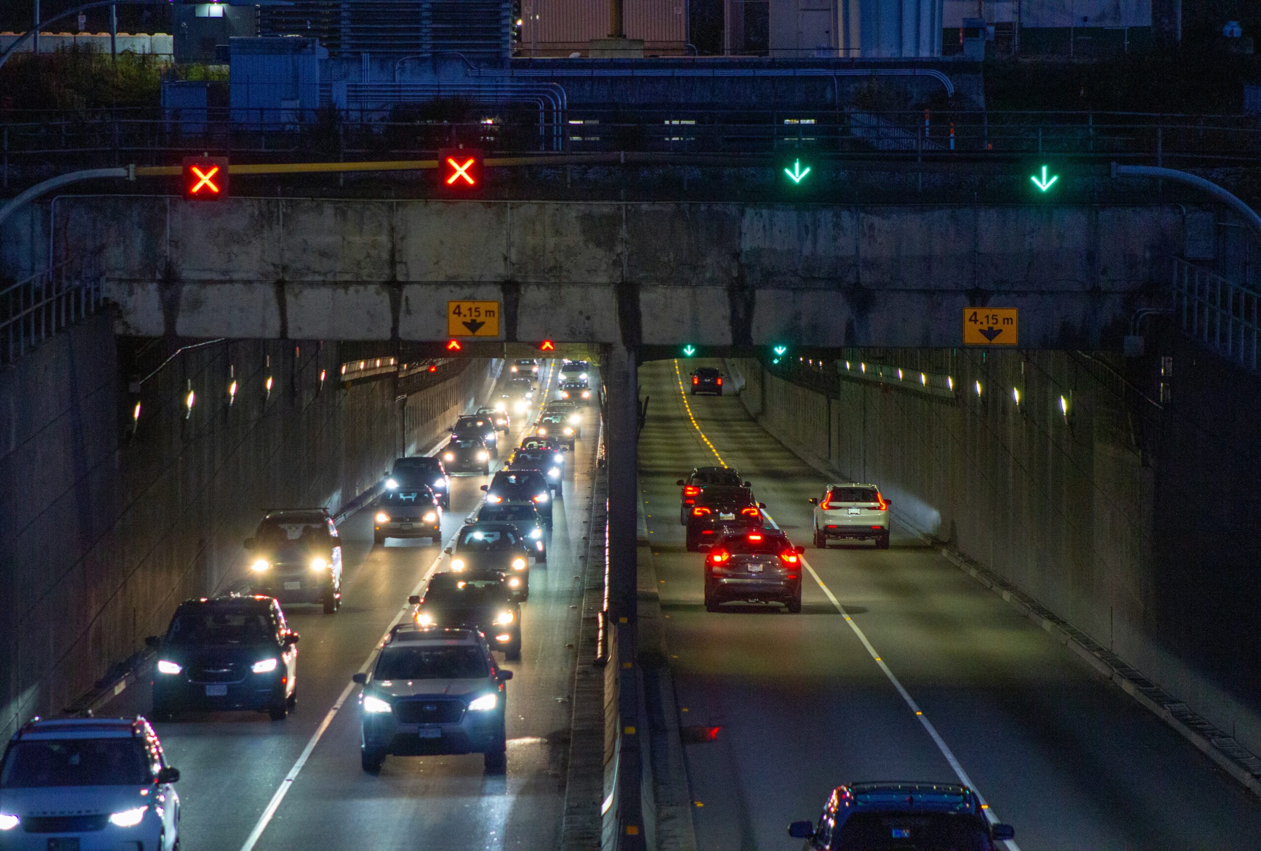 Night traffic moving through a tunnel in Richmond, BC, with A1 Terps branding for Weed Delivery Richmond."