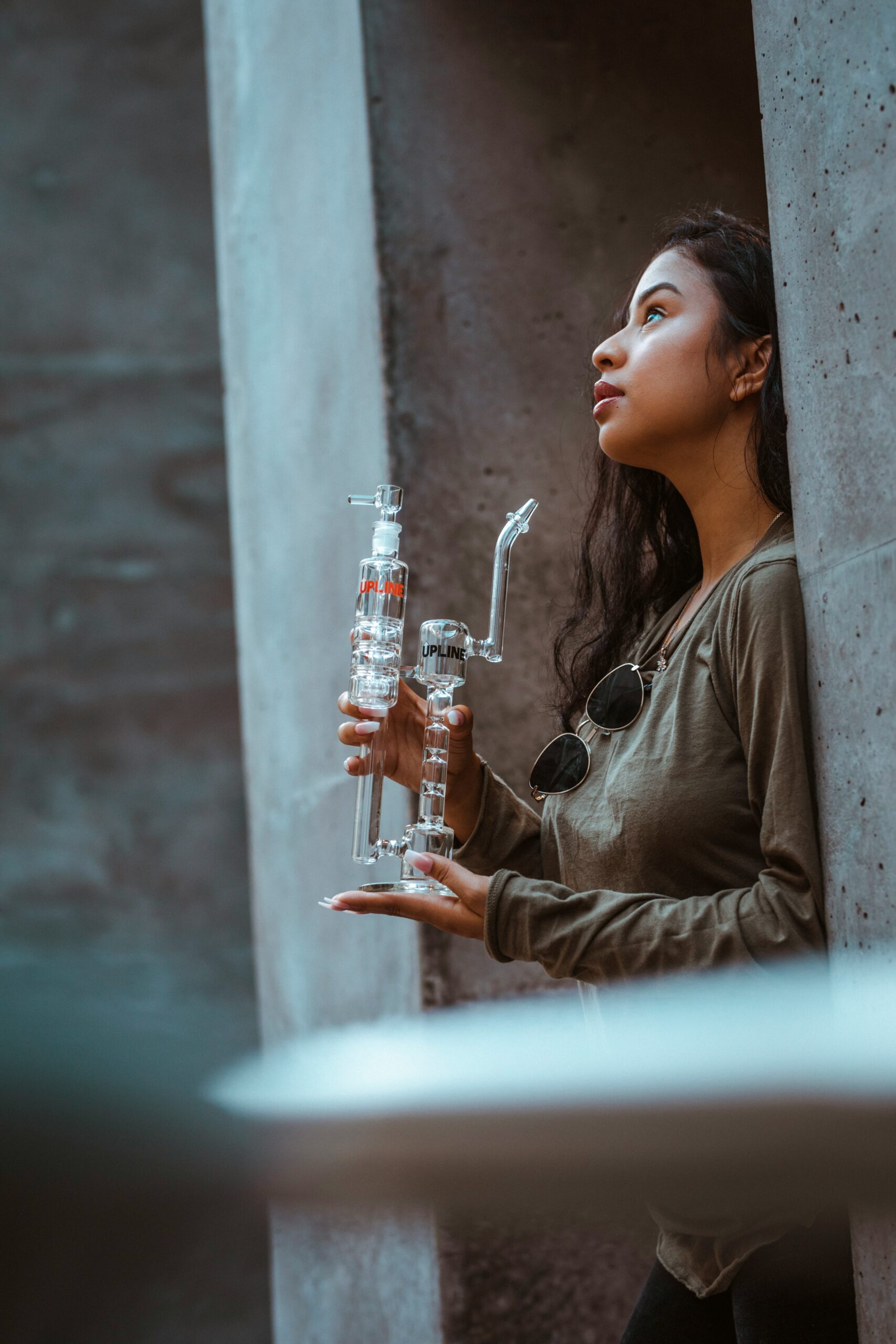 Weed delivery Calgary: A person holding a glass cannabis rig