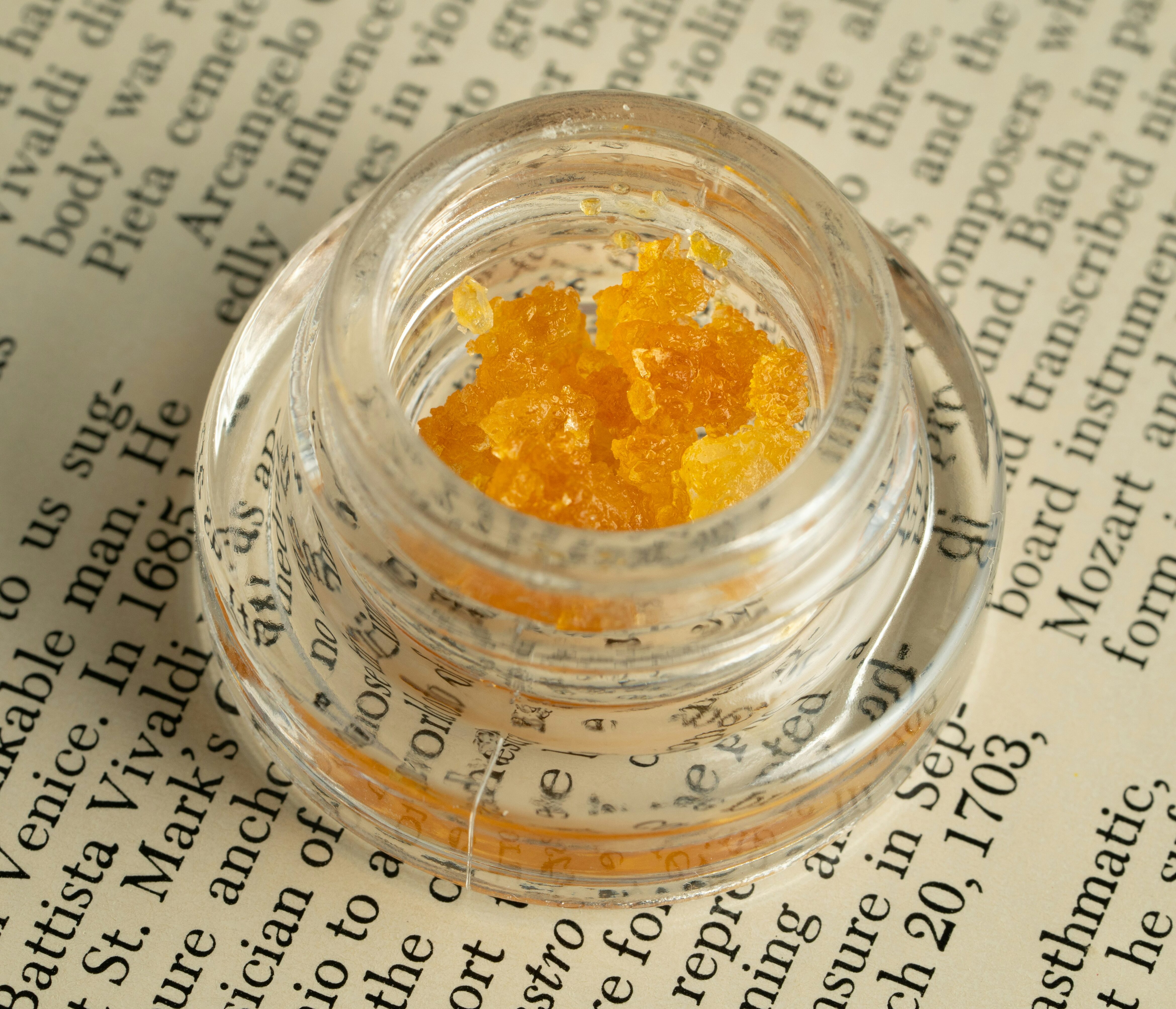 Close-up of cannabis concentrate in a container.