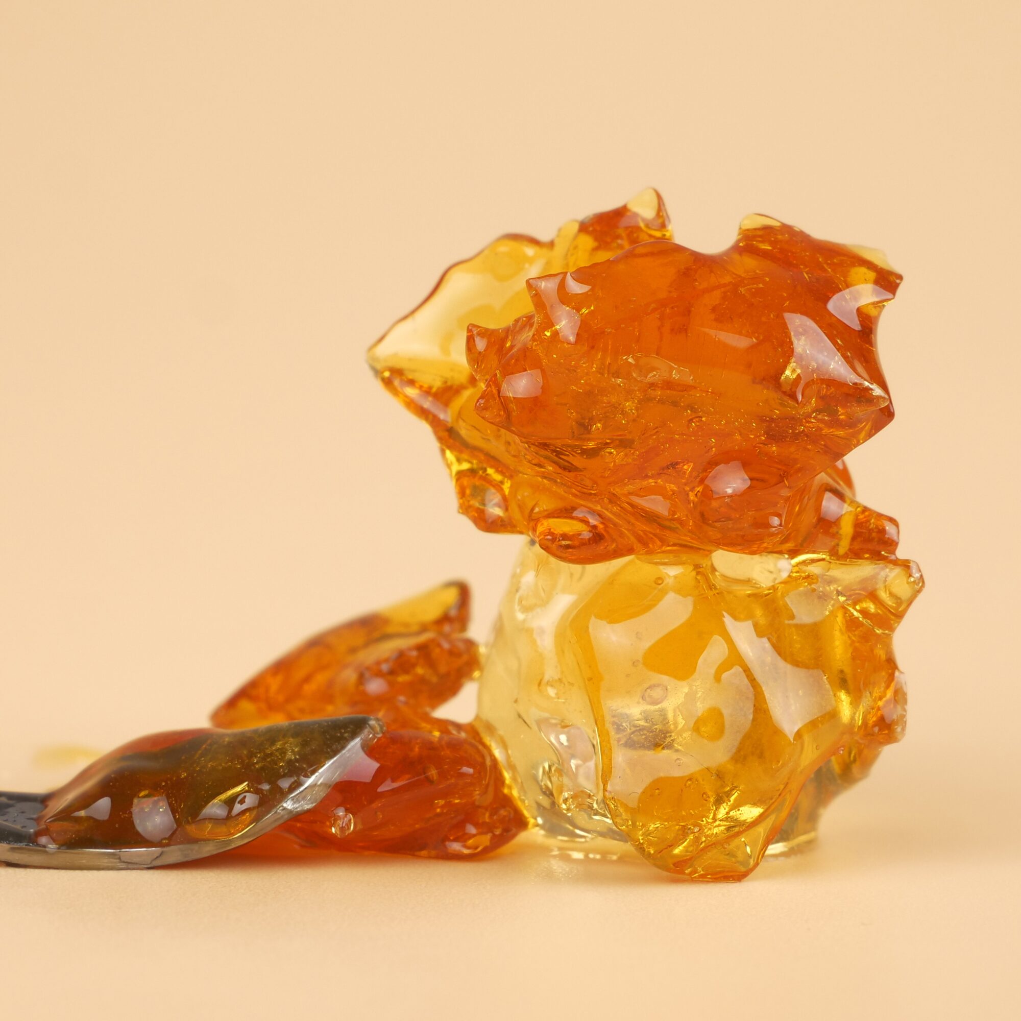 Golden cannabis concentrate representing affordable dabbing options in Canada.