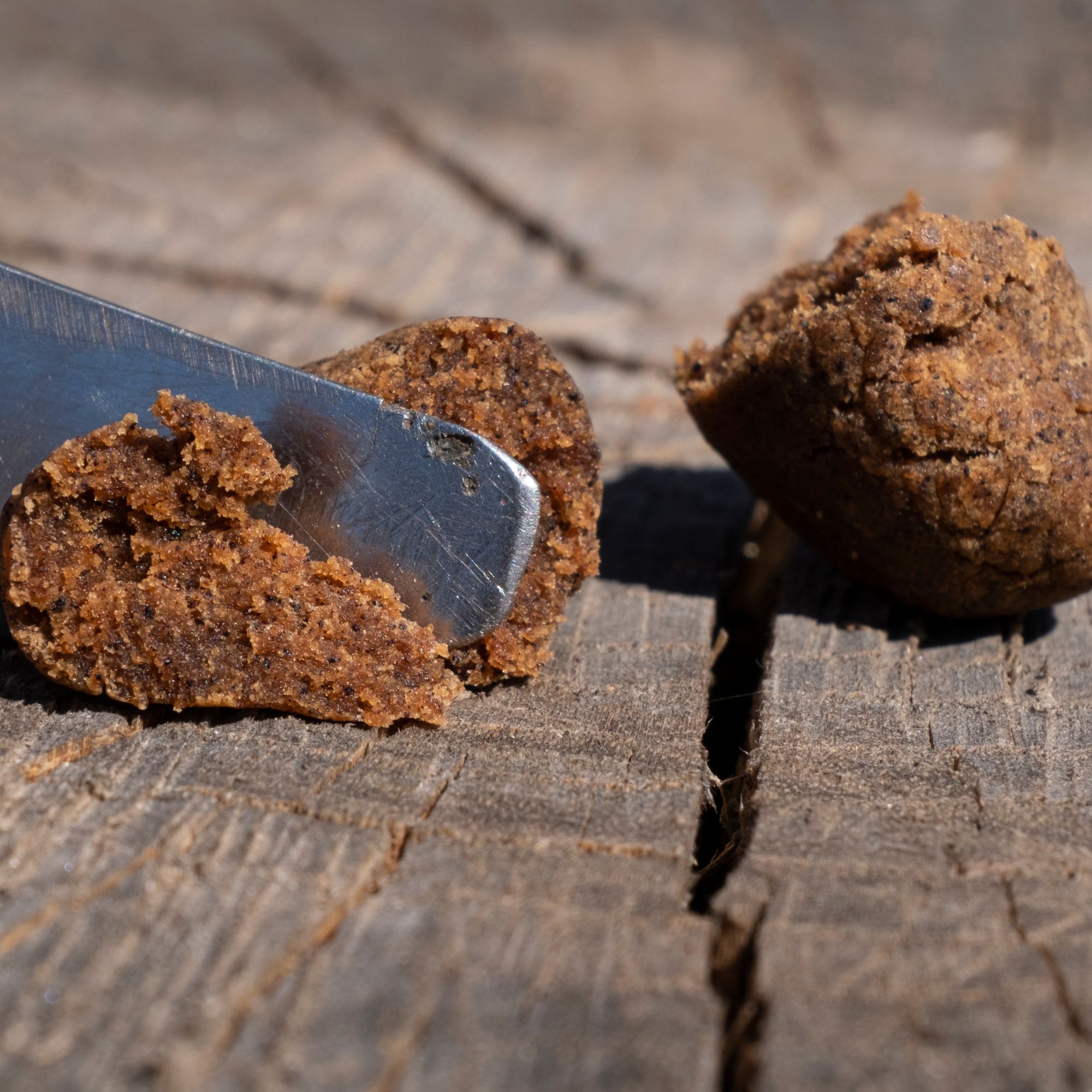 Moroccan Habibi Hash being cut with a tool, highlighting texture.